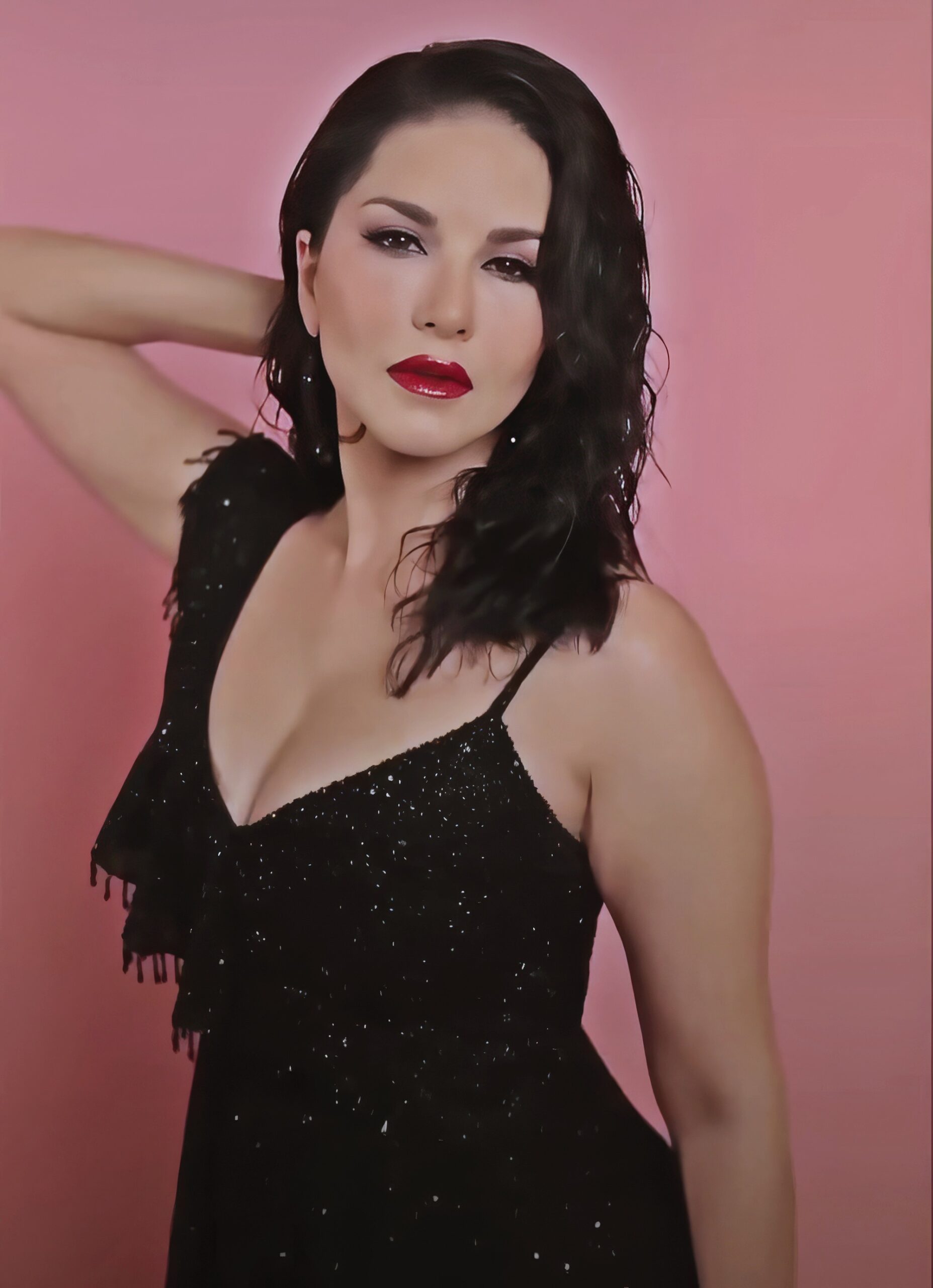 Sunny Leone at 43 Years Old as Erotic Centerfold Model and Bollywood India Star (2024) Red Lips Wet Hair Brunette Black Bright Dress